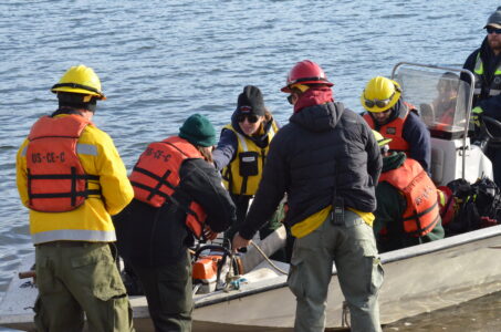 Crews load the boat that will take them to the Sugar Bay fire Wednesday morning.